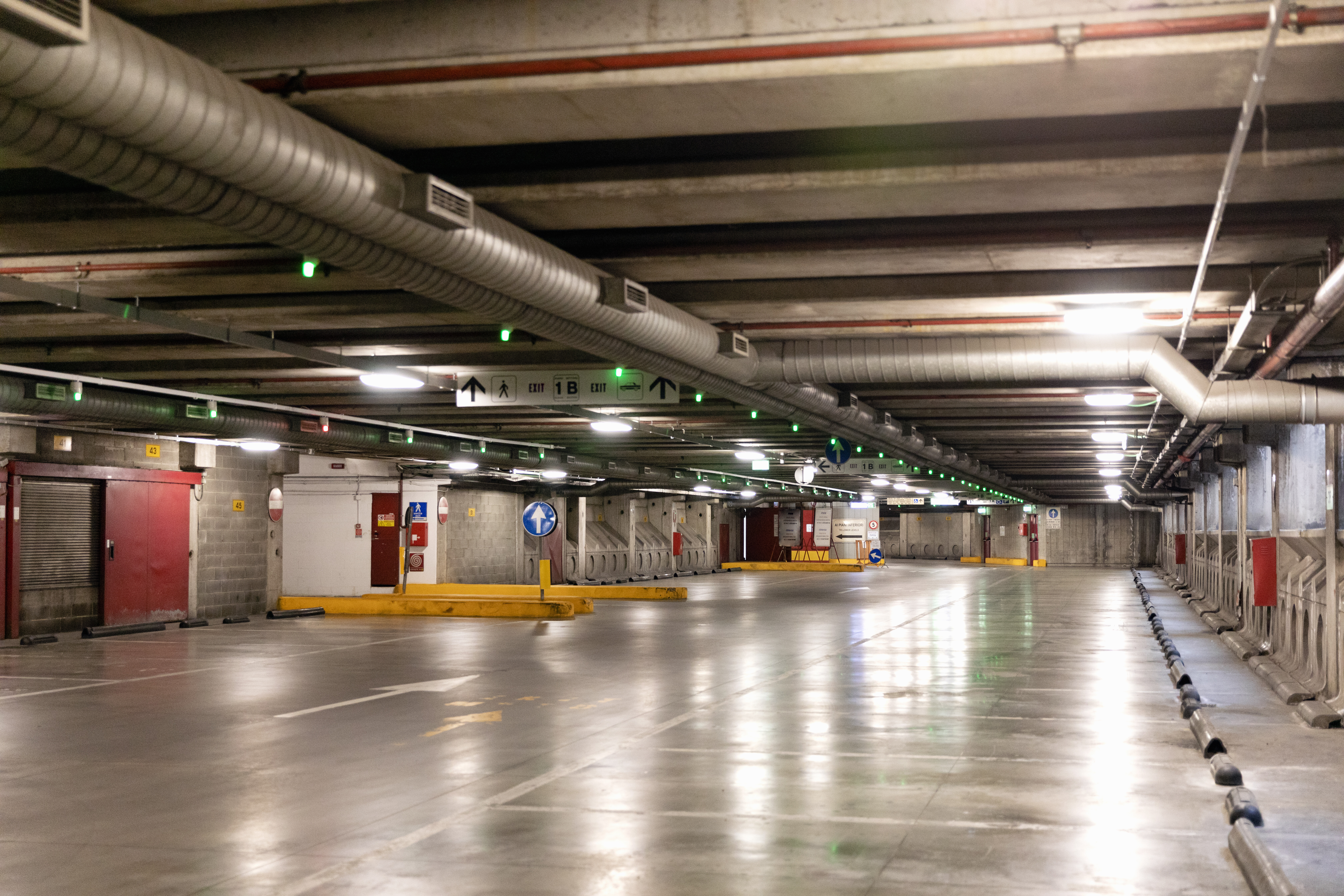 Empty underground parking garage with ambient lighting